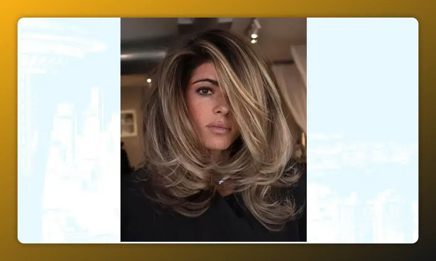 Salonfoto eines voluminösen Blowouts mit weichen, geschichteten Layers und Curtain-Teil